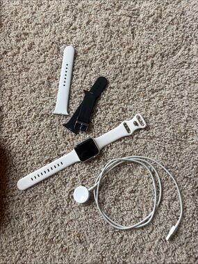 White Apple Watch Series 3 with Extra Bands and Magnetic Charger